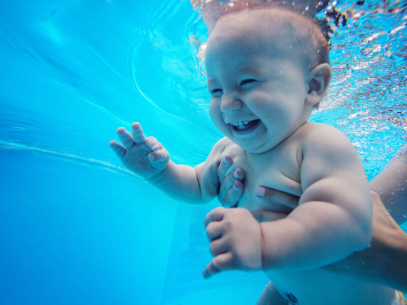 Baby,Background.,Happy,Infant,Learn,To,Swim,,Dive,Underwater,With